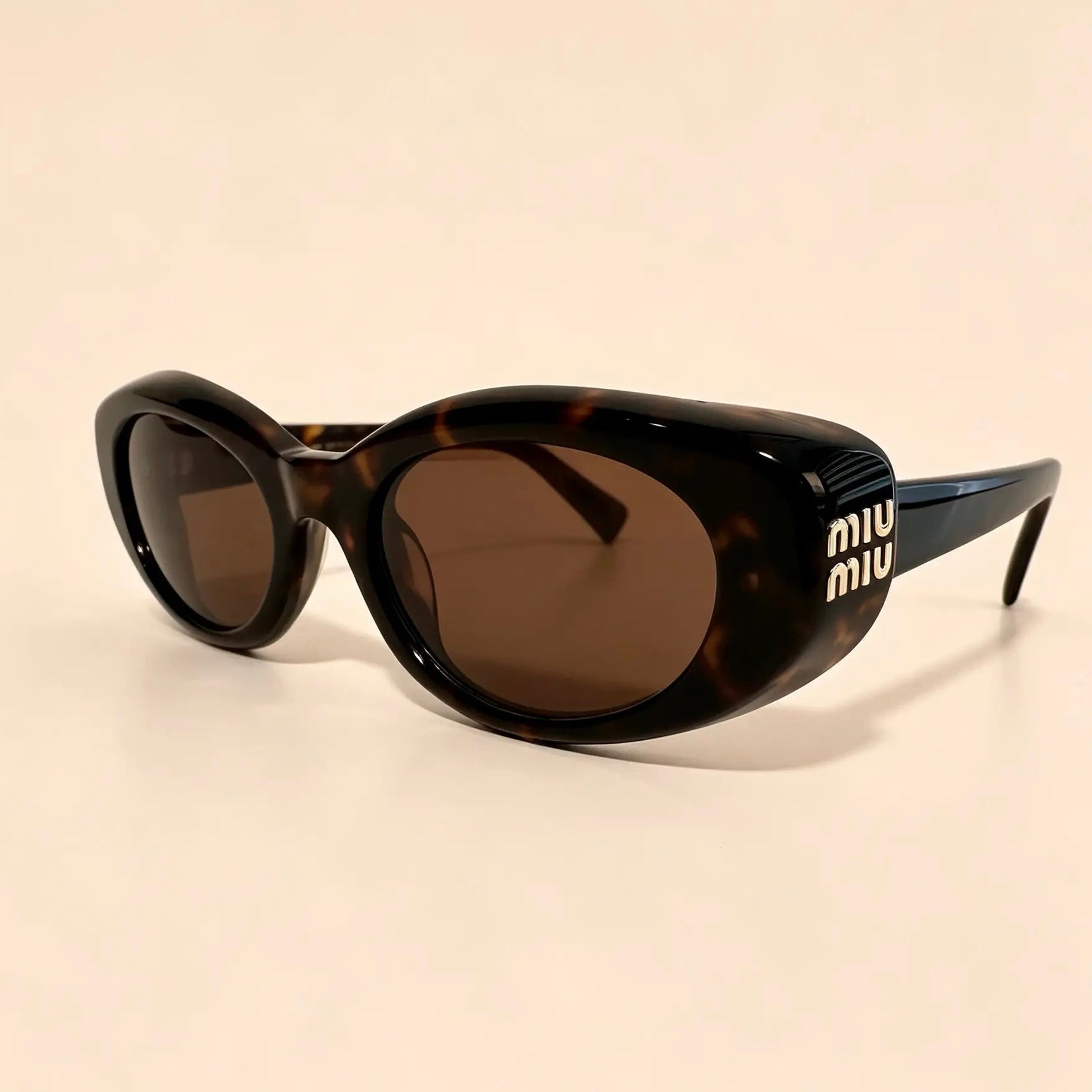 Lentes de sol MIU MIU